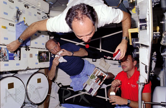 Astronauts in space shuttle Discovery oct. 1988