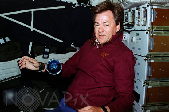 Astronaut with microgravity experiment