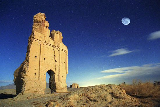 Moon and starry sky above an ancient city in Iran