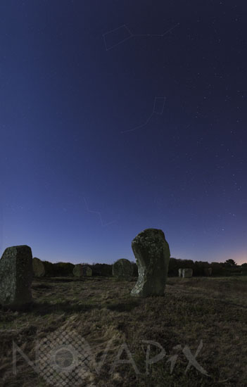 Starry sky above standing stones in Carnac (with constellations lined)