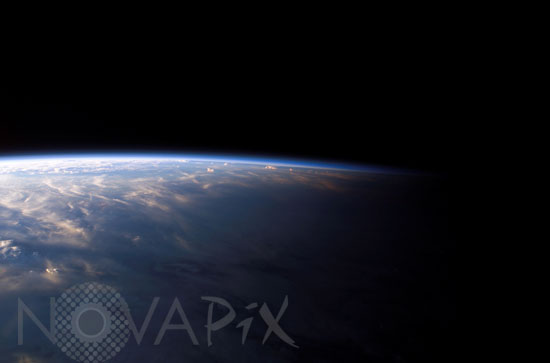 Clouds and earth terminator seen from space shuttle Columbia