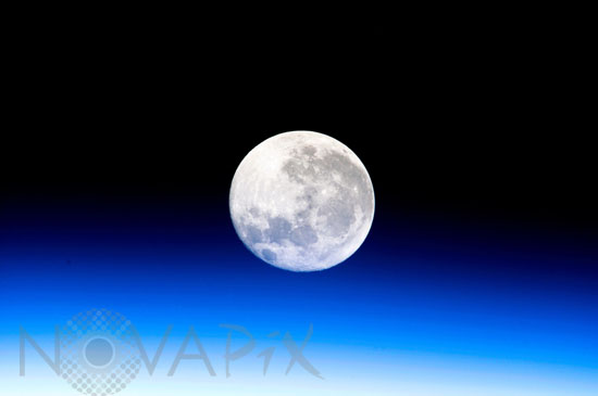 Full moon above the atmosphere