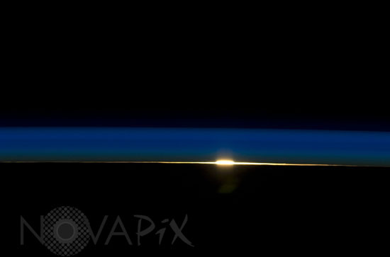 Earth's atmosphere and rising sun 07/2009