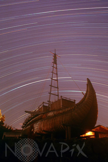 Star Trails Over an ancient boat