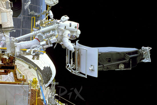 J. Hoffman with Wide Field/Planetary Camera during EVA. 12/1993