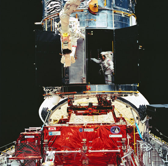 Astronauts install COSTAR during EVA for HST repair