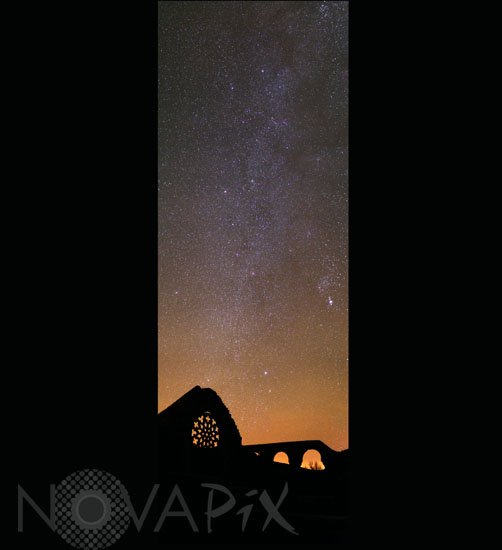 Starry sky above an old chapel