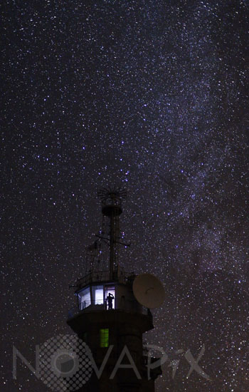 Milky Way behind control tower of Pointe du Raz
